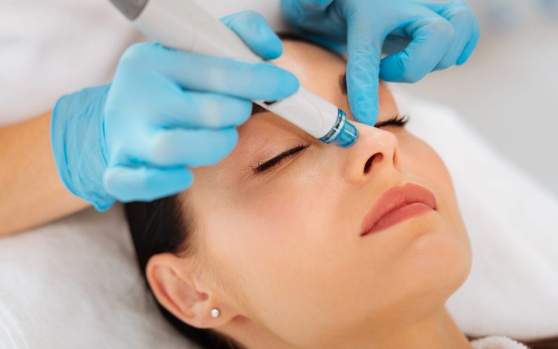 Face of a nice good looking woman during hydrafacial woman during hydrafacial